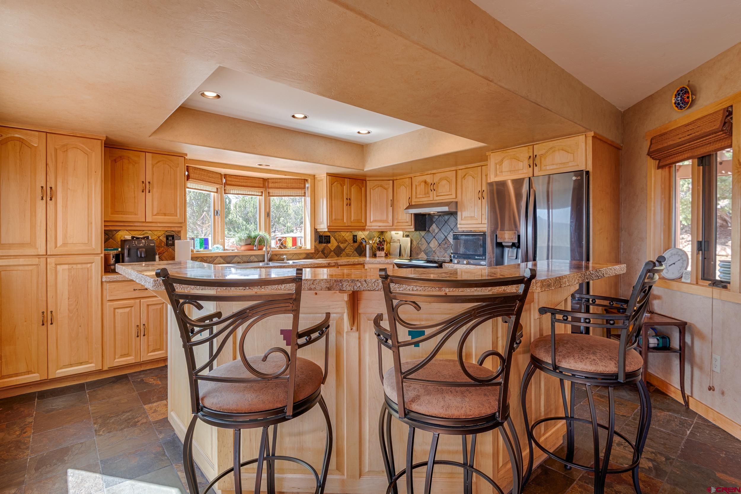 20891 Solitude Road Montrose, CO 81403 - Photo 8 of 39 a dinning area with chairs and table room