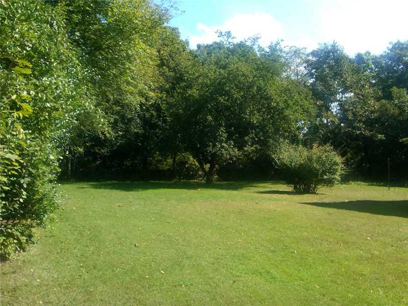 133 Brookfield Road East Providence, RI 02915 - Photo 8 of 16 Yard/Garden. The grounds include pretty trees and shrubs and has a pretty stone wall.