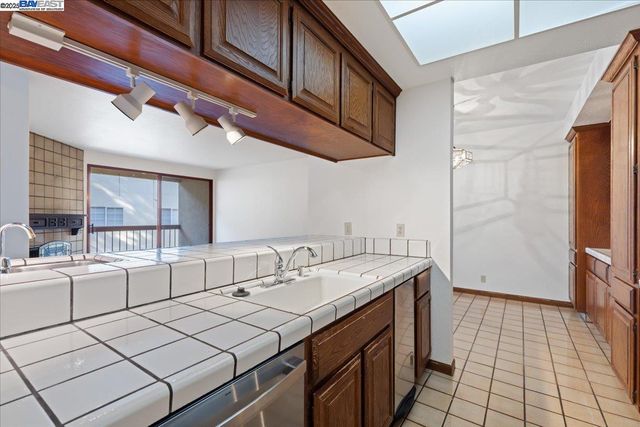 a kitchen with a sink cabinets and appliances