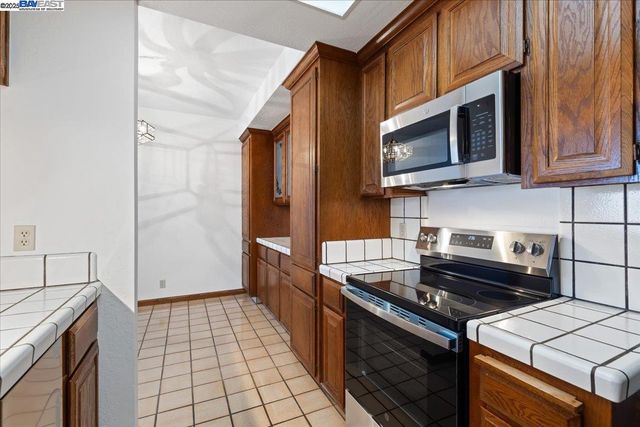 a kitchen with a stove and a microwave