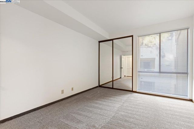 an empty room with sliding glass door