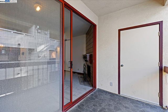 a view of a bathroom with a glass door shower