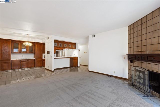 a view of a kitchen with a sink oven cabinets and a kitchen