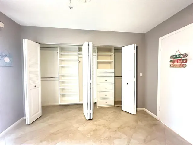 a bathroom with a sink toilet a mirror and shower