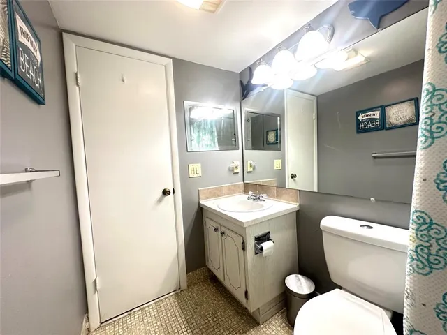 a living room filled with furniture and a floor to ceiling window