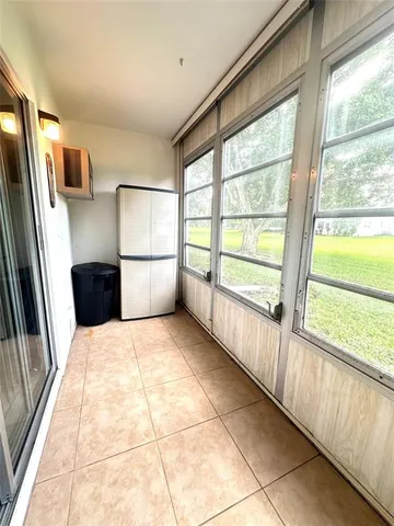 a view of livingroom with furniture and floor to ceiling window