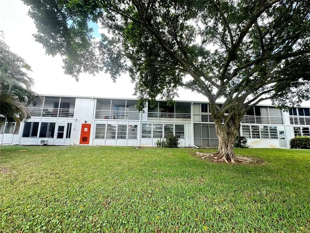 a view of a house with a big yard