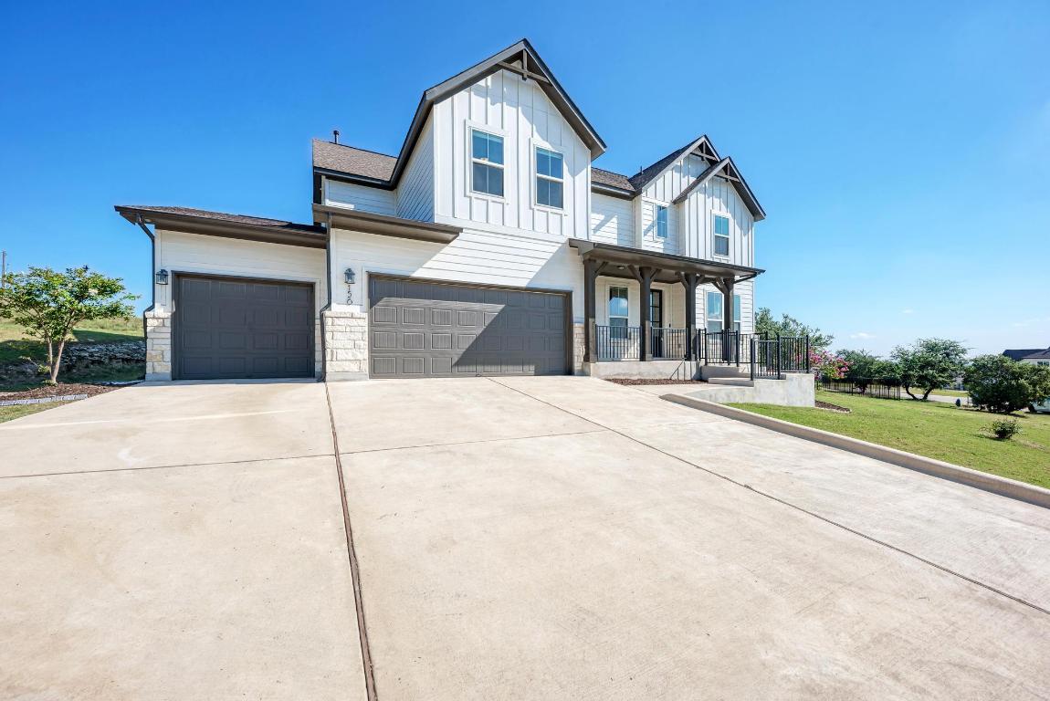 156 Verdejo Drive Dripping Springs, TX 78620 - Photo 1 of 38 a front view of a house with a yard