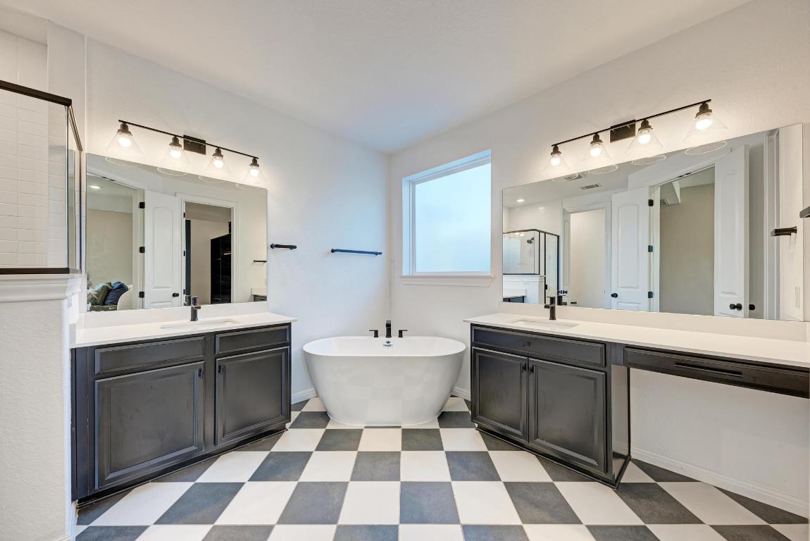 156 Verdejo Drive Dripping Springs, TX 78620 - Photo 22 of 38 a hall with a sink and a mirror