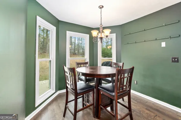 a view of a dining room with furniture window and chandelier