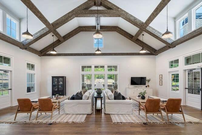 5385 Keepsake Court Cumming, GA 30040 - Photo 6 of 16 a living room with furniture a flat screen tv and a large window