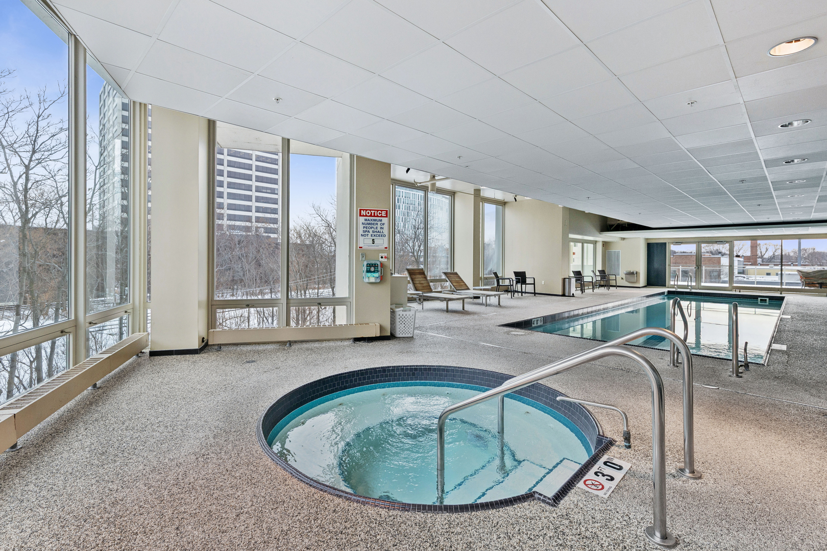1570 Elmwood Avenue, Unit 1504 Evanston, IL 60201 - Photo 20 of 24 a view of a dining room with furniture large windows and wooden floor