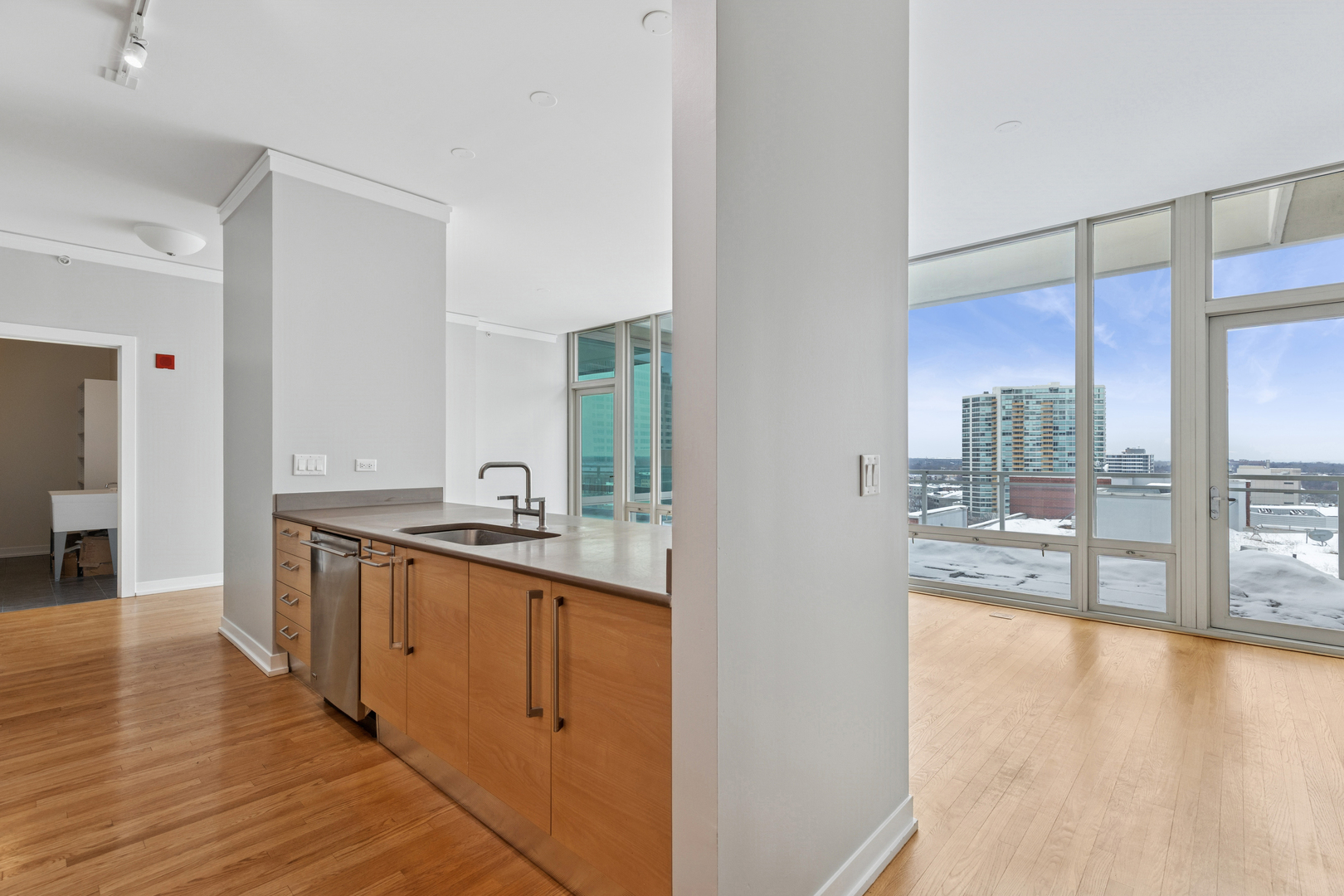 1570 Elmwood Avenue, Unit 1504 Evanston, IL 60201 - Photo 7 of 24 a view of a kitchen from the hallway