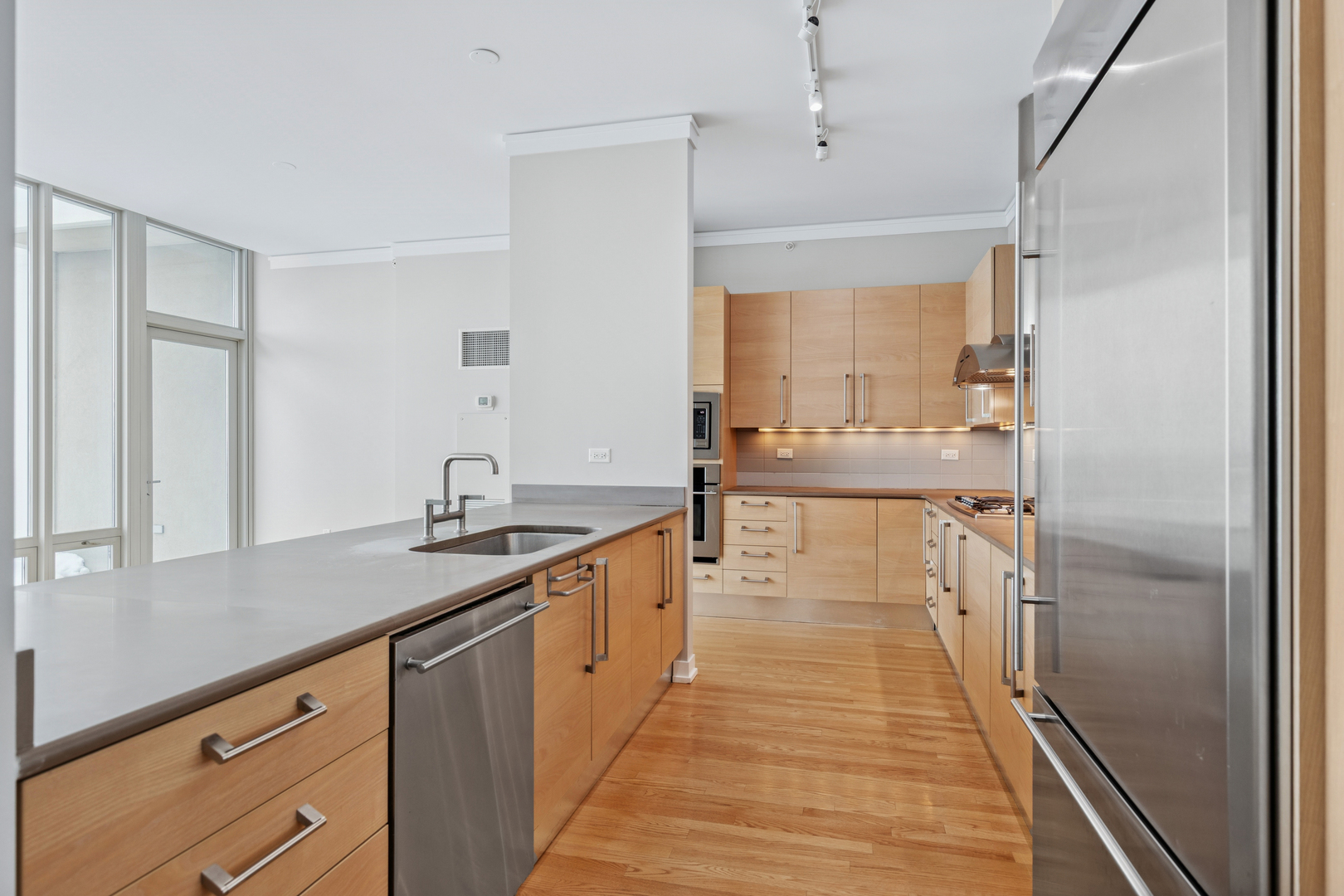 1570 Elmwood Avenue, Unit 1504 Evanston, IL 60201 - Photo 8 of 24 a spacious bathroom with a granite countertop sink a mirror and shower