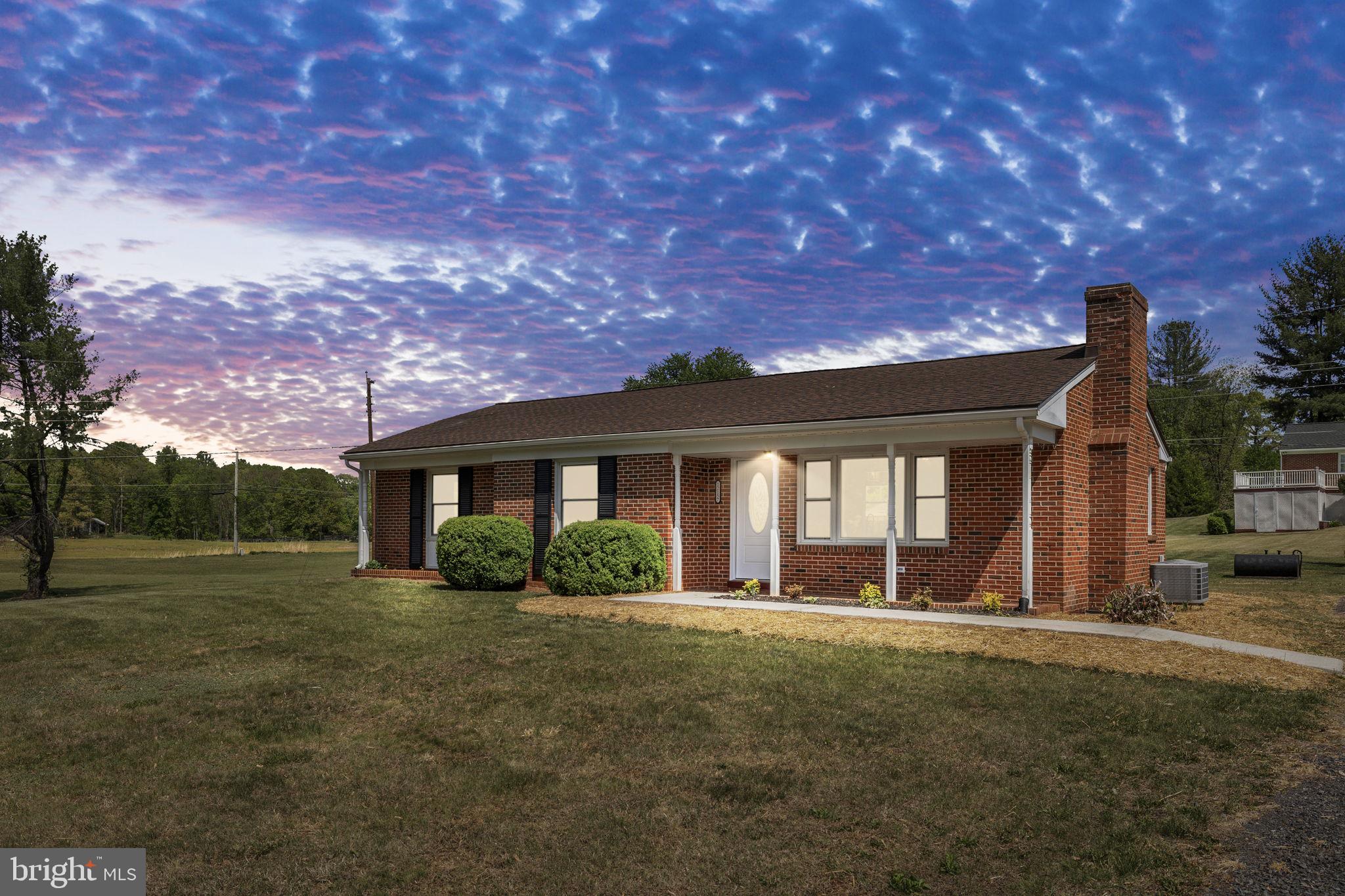 12157 Octonia Road Orange, VA 22960 - Photo 2 of 45 Charming home under a vibrant sky.