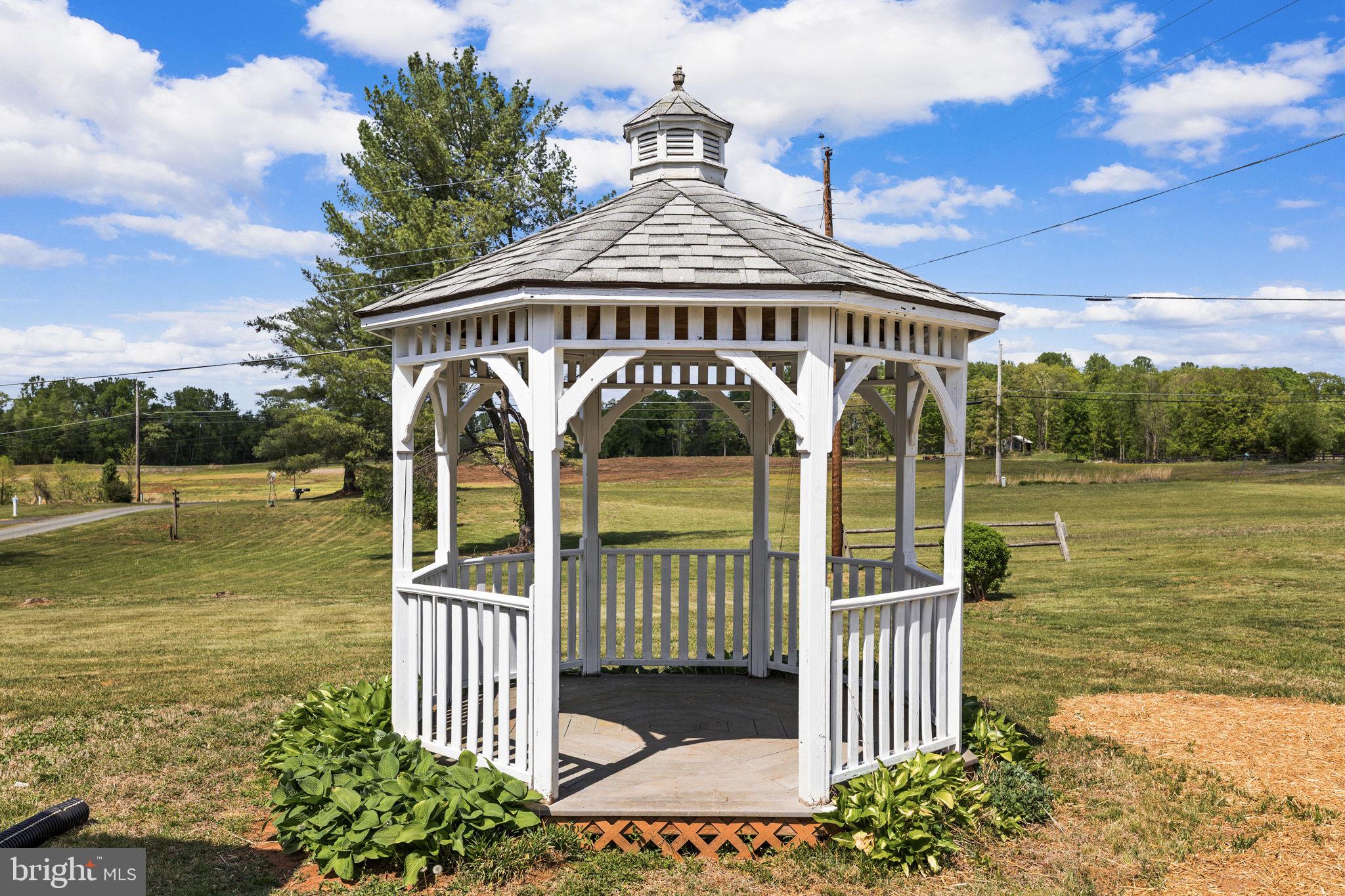 12157 Octonia Road Orange, VA 22960 - Photo 41 of 45 Charming gazebo in a serene landscape.