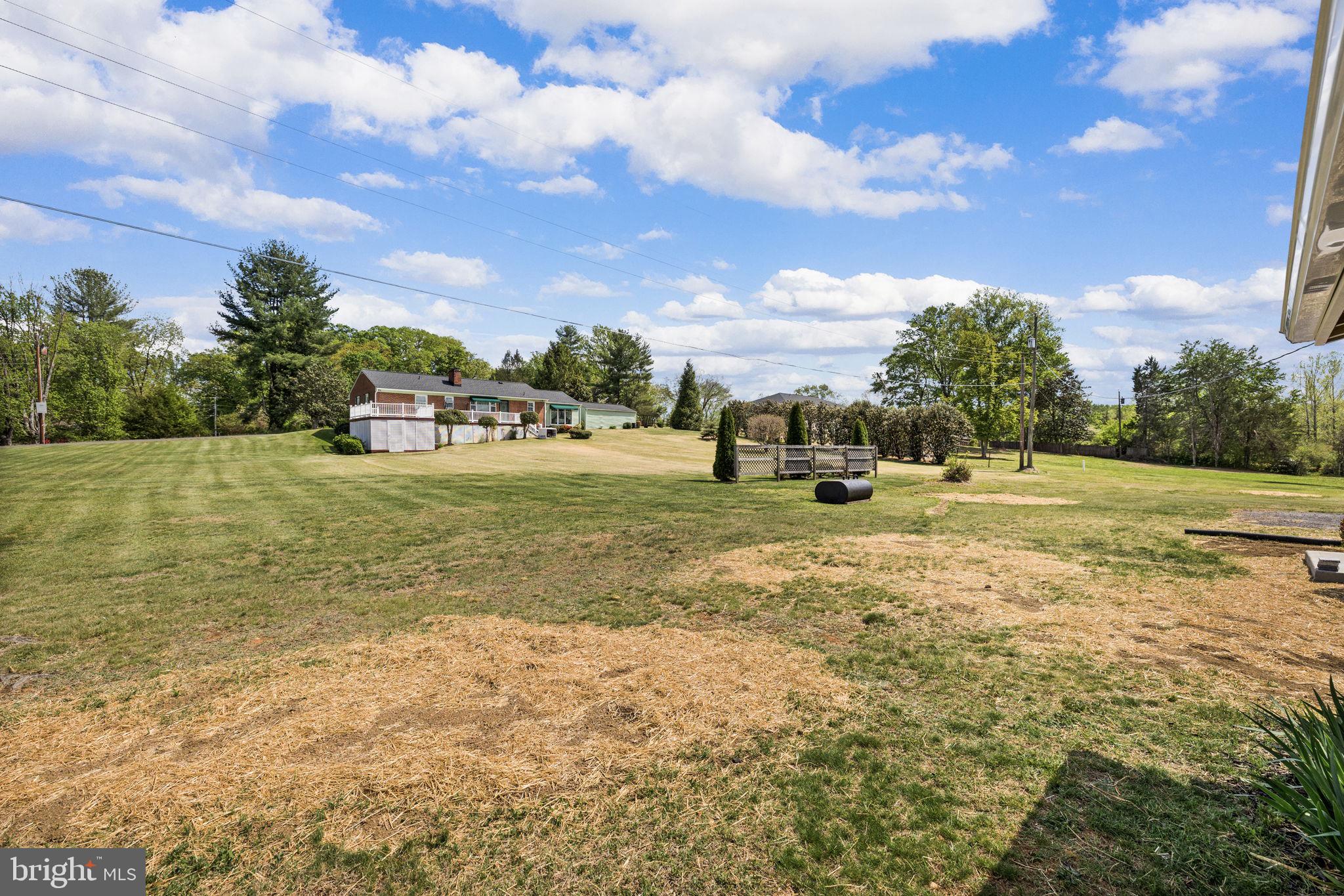 12157 Octonia Road Orange, VA 22960 - Photo 43 of 45 Spacious green retreat under blue skies.