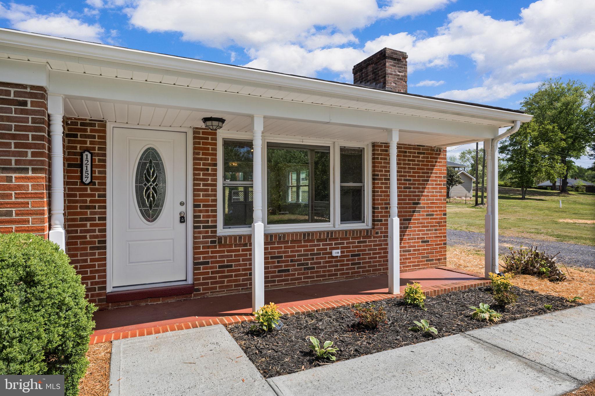 12157 Octonia Road Orange, VA 22960 - Photo 6 of 45 Charming brick entryway with greenery.