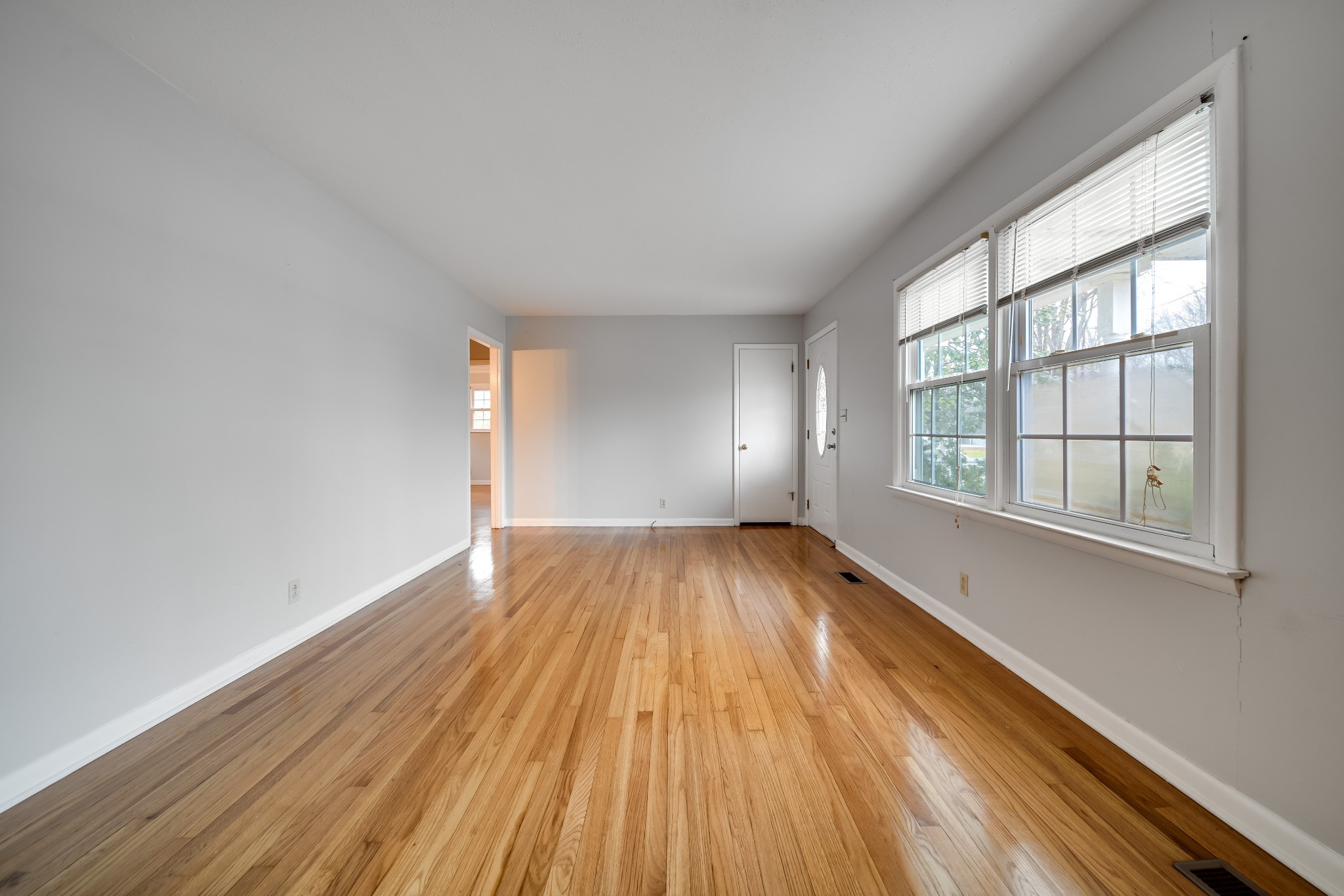 5945 Dividing Ridge Road Goodlettsville, TN 37072 - Photo 19 of 46 an empty room with wooden floor and windows
