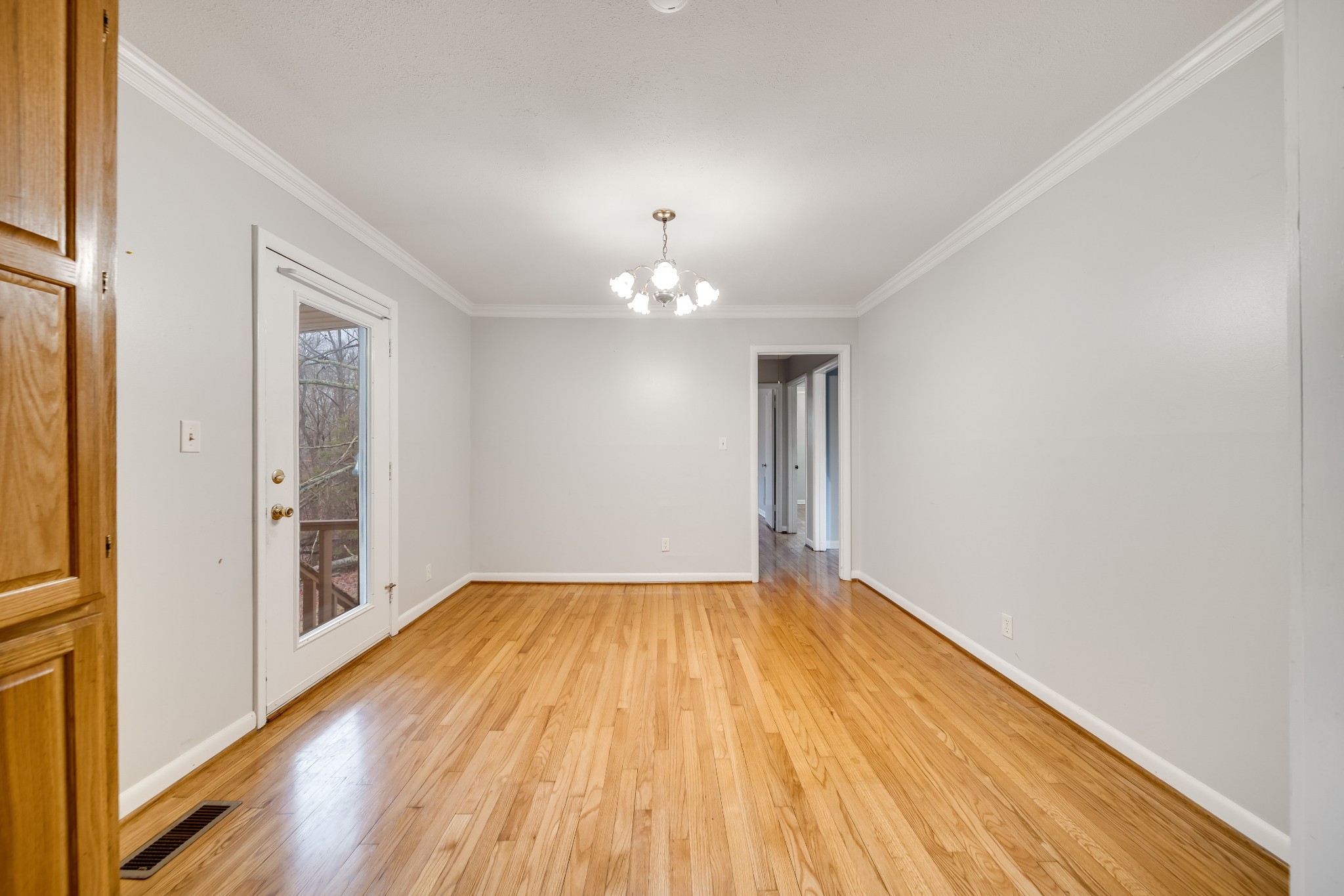 5945 Dividing Ridge Road Goodlettsville, TN 37072 - Photo 28 of 46 a view of an empty room with wooden floor and a window