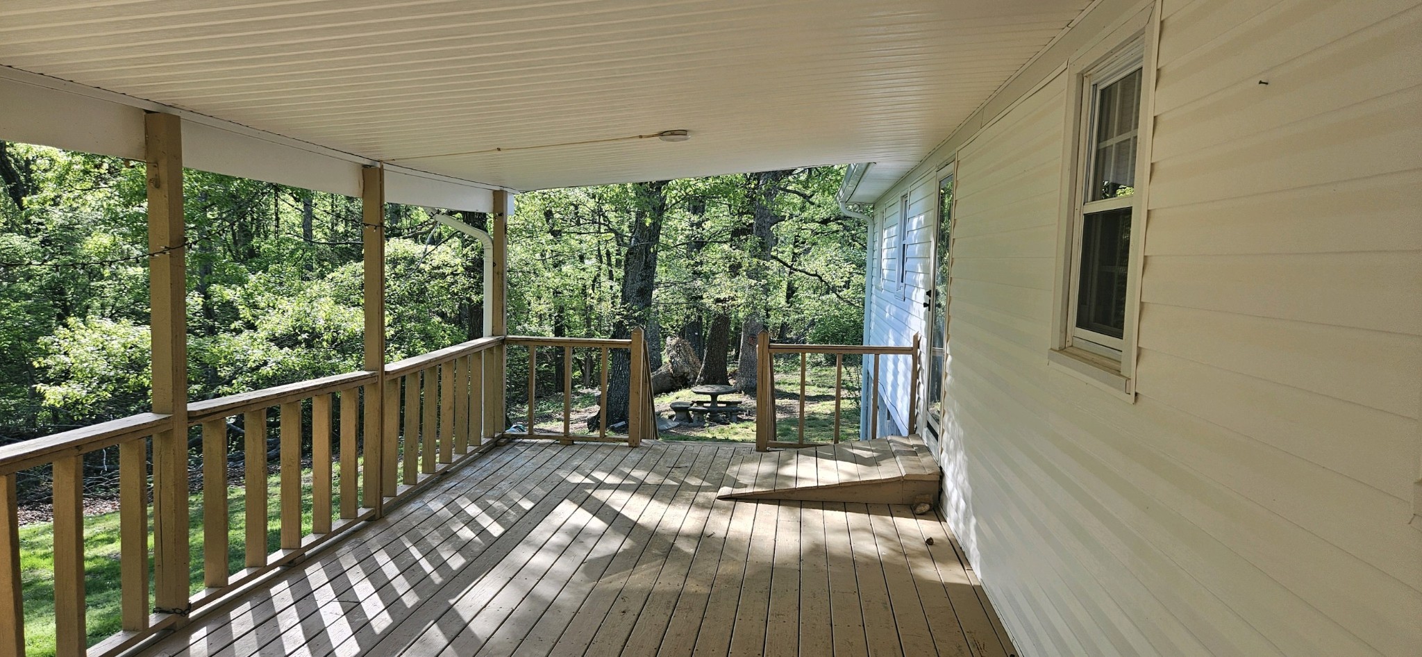 5945 Dividing Ridge Road Goodlettsville, TN 37072 - Photo 43 of 46 a view of a balcony with chairs and wooden floor