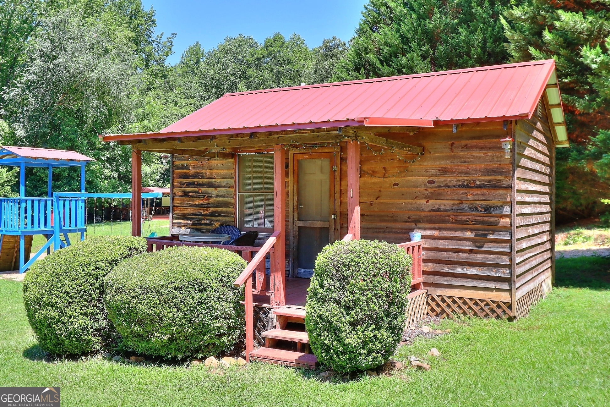 95 Cedar Hollow Road Cleveland, GA 30528 - Photo 31 of 54 a front view of a house with garden