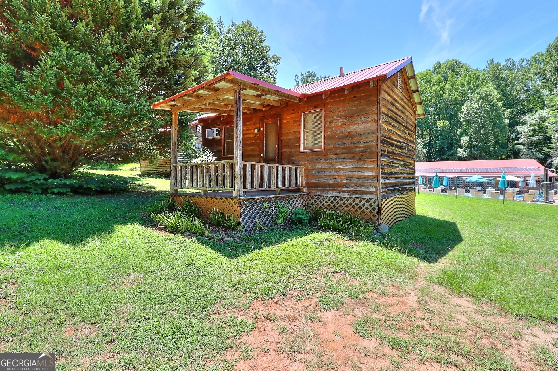 95 Cedar Hollow Road Cleveland, GA 30528 - Photo 32 of 54 a front view of a house with garden
