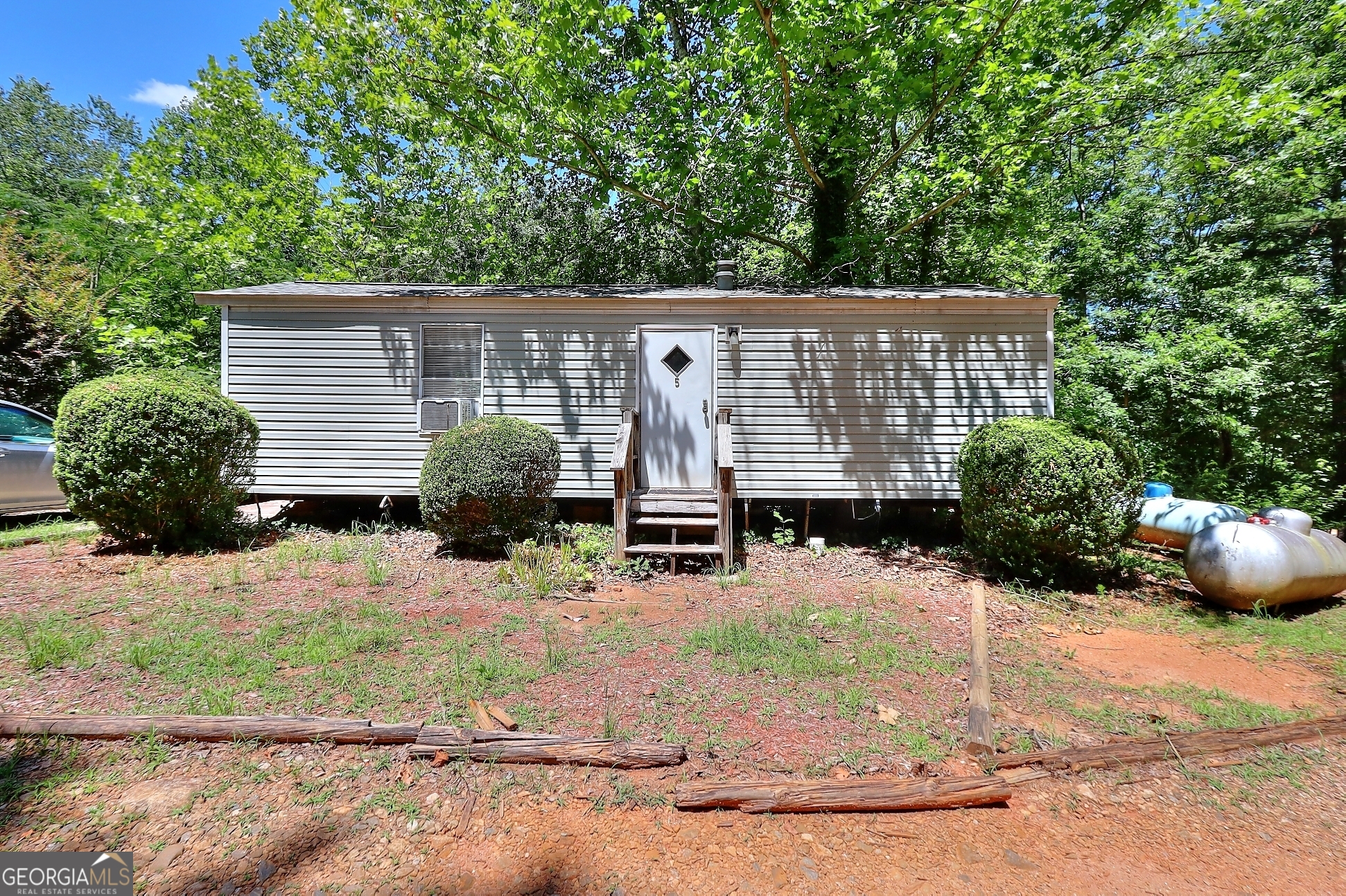 95 Cedar Hollow Road Cleveland, GA 30528 - Photo 49 of 54 a view of a house with a yard plants and large tree
