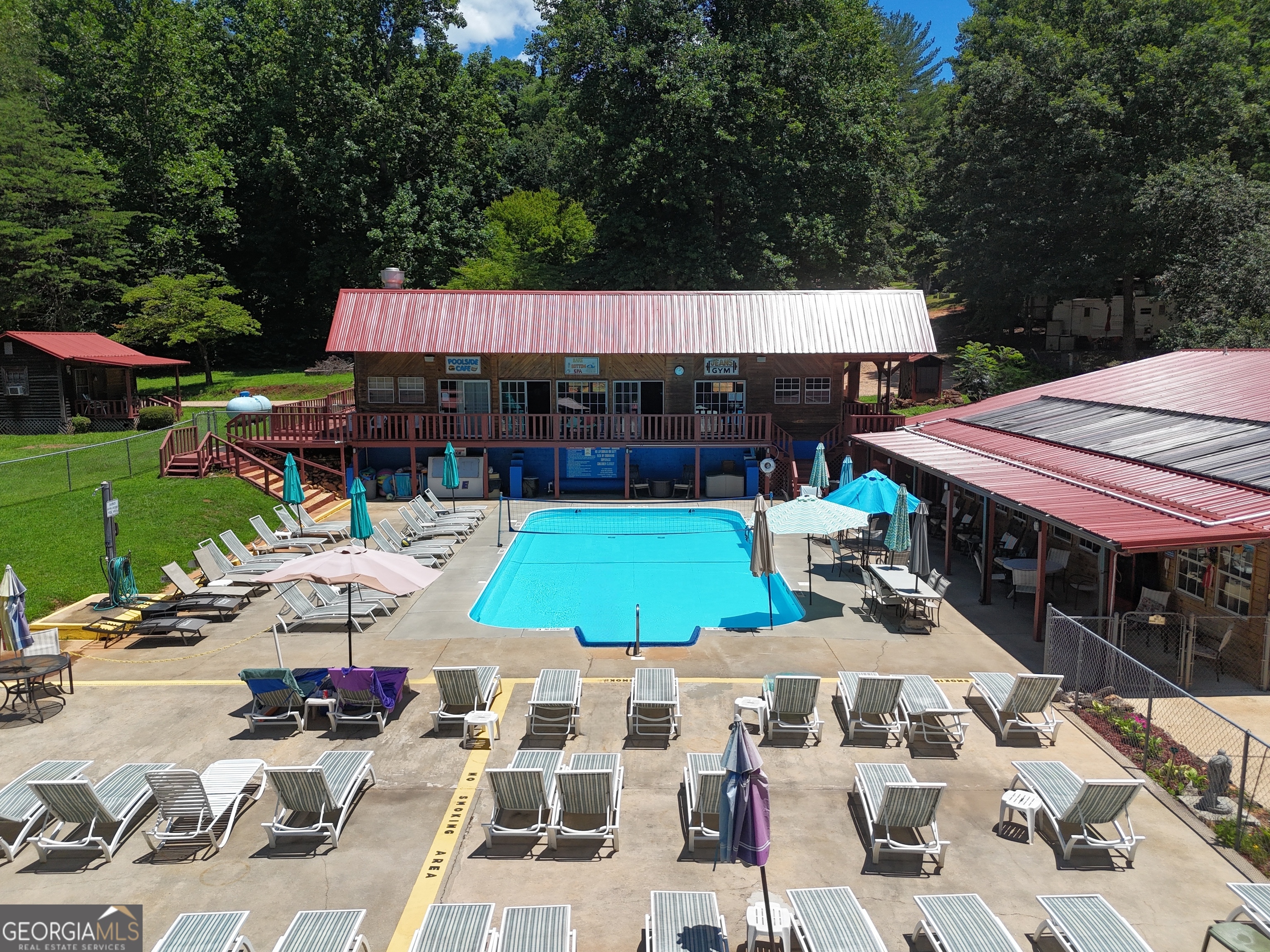 95 Cedar Hollow Road Cleveland, GA 30528 - Photo 7 of 54 an outdoor space with furniture and umbrella