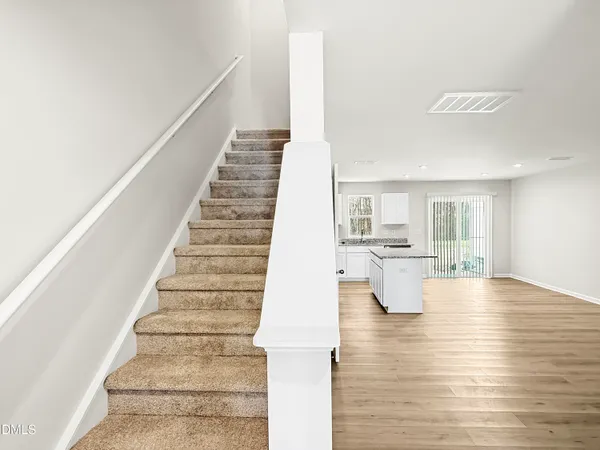 a view of entryway and kitchen