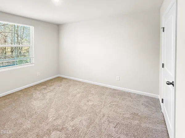 an empty room with a natural light