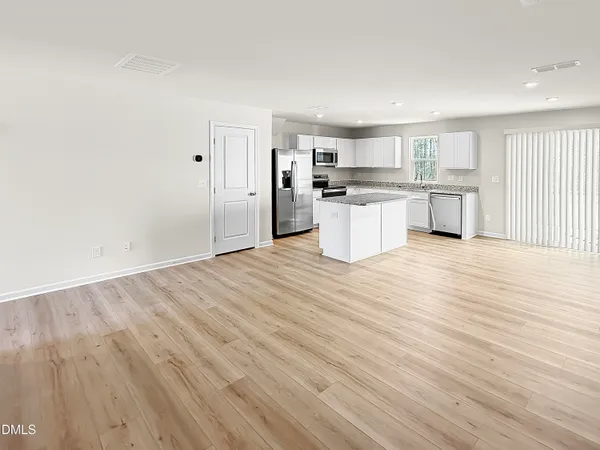 a view of kitchen with wooden floor