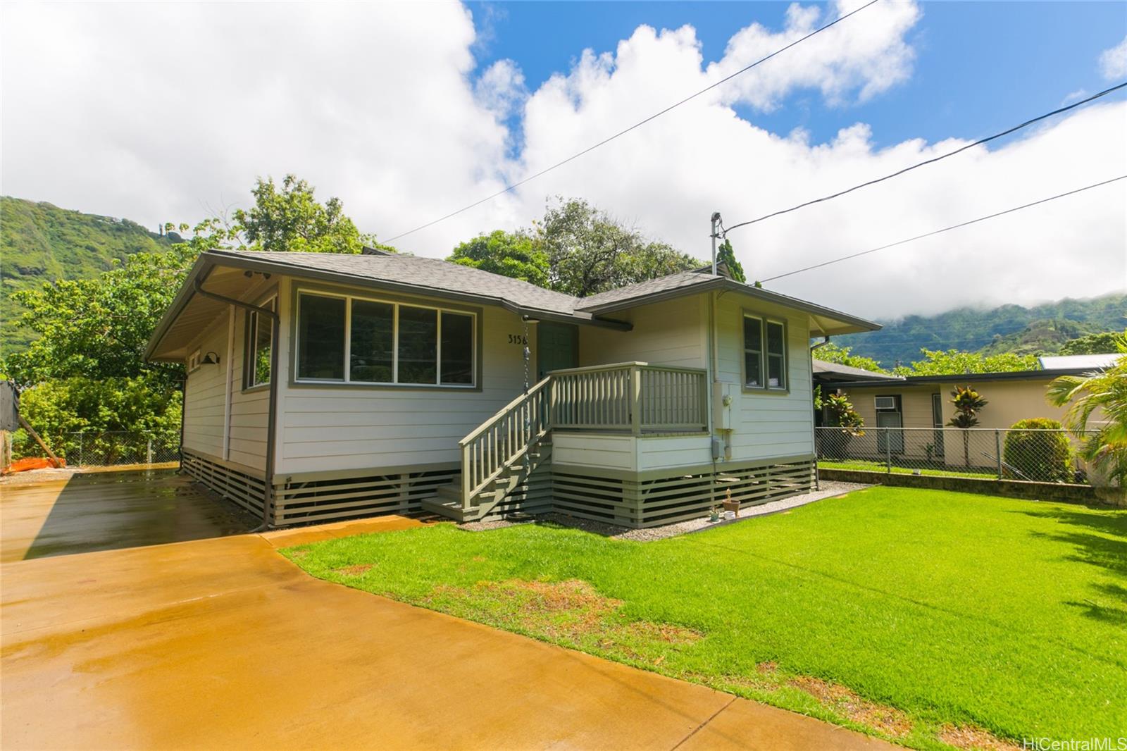 3156 East Manoa Road Honolulu, HI 96822 - Photo 1 of 1 a front view of a house with a yard