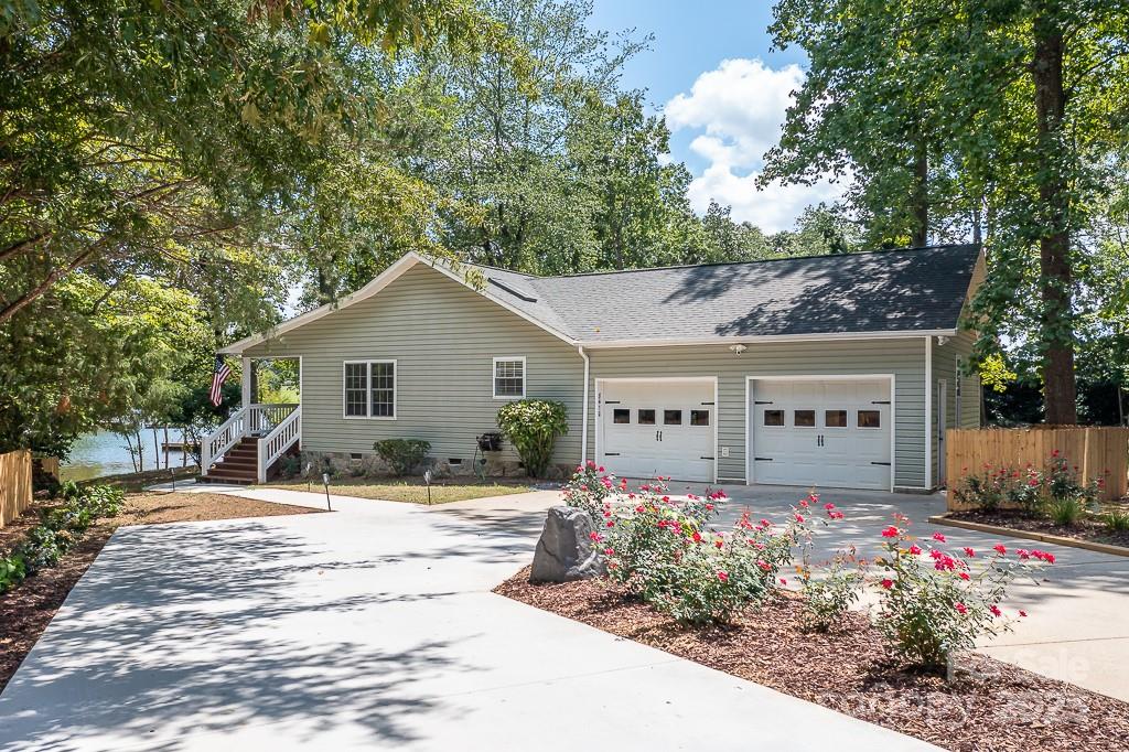 8410 Slate Street Terrell, NC 28682 - Photo 27 of 38 a front view of a house with a yard and outdoor seating