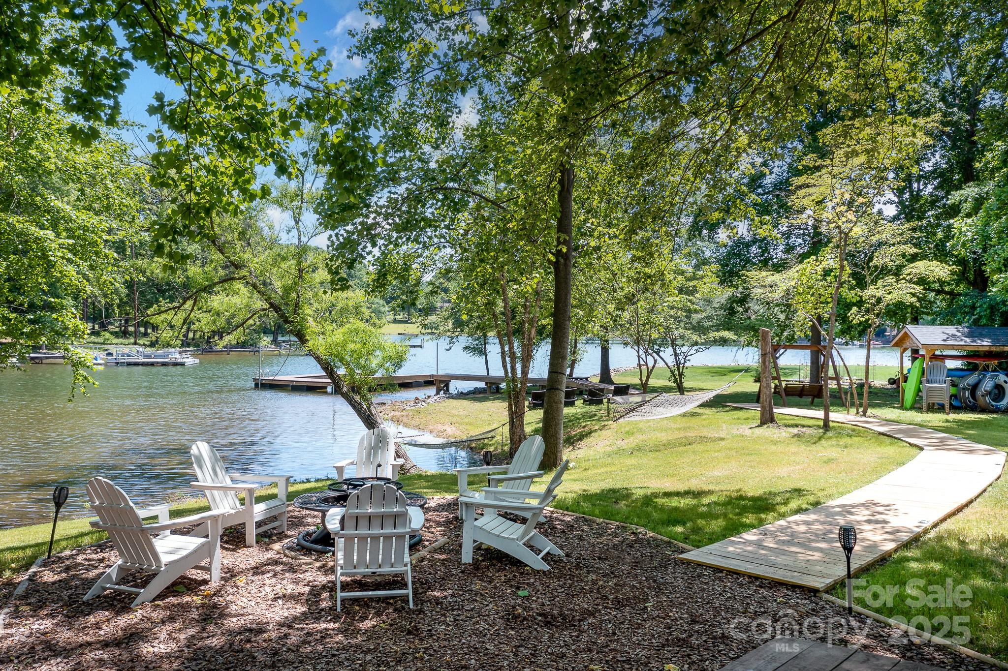 8410 Slate Street Terrell, NC 28682 - Photo 29 of 38 a swimming pool with outdoor seating and yard