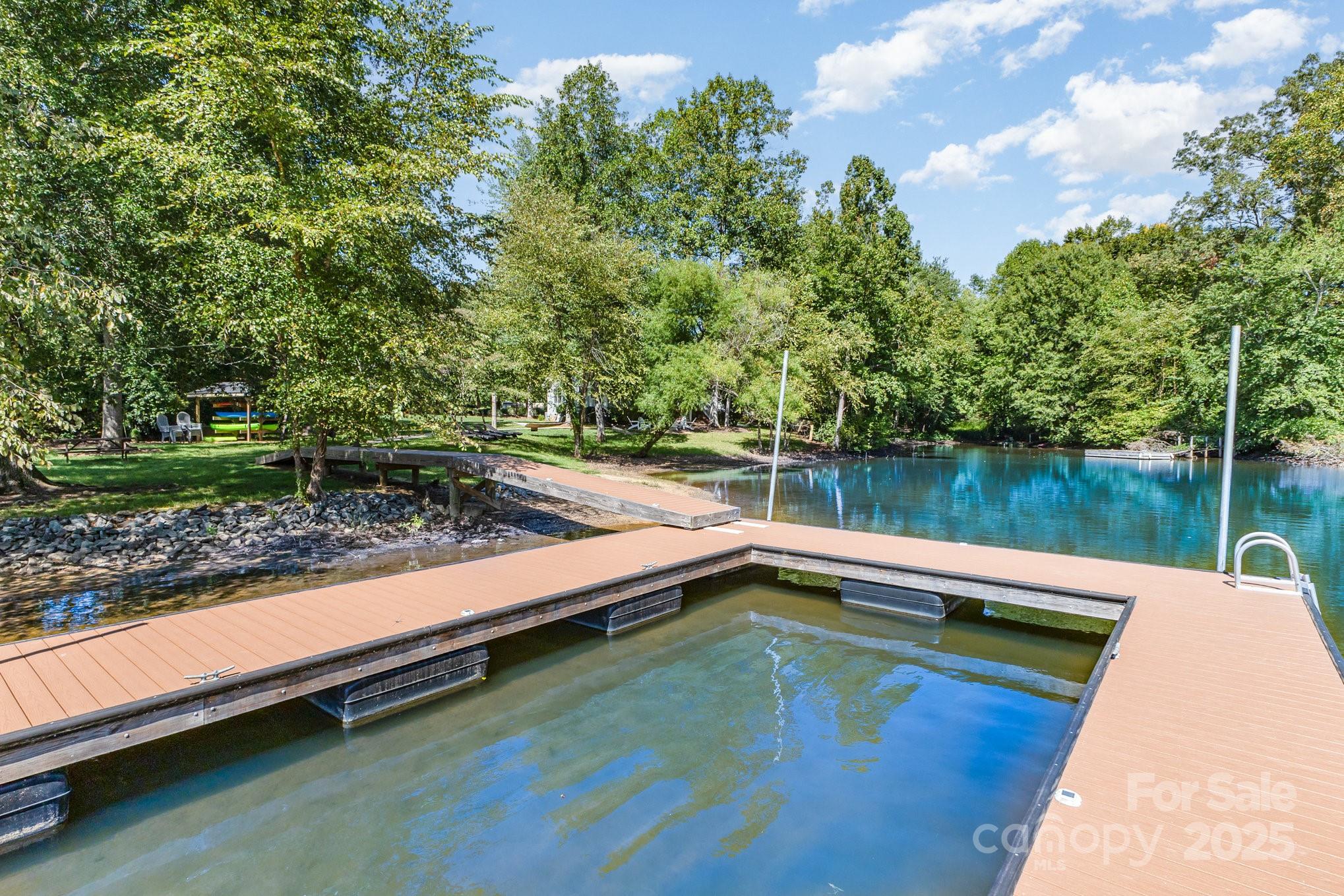 8410 Slate Street Terrell, NC 28682 - Photo 33 of 38 a view of a lake with a large pool