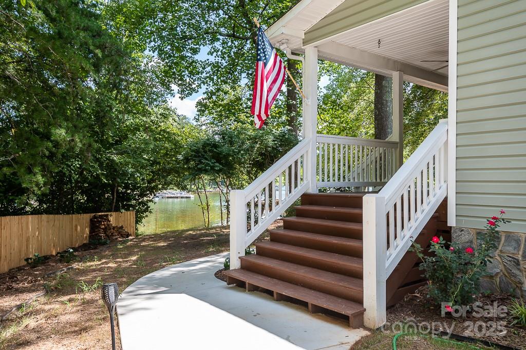 8410 Slate Street Terrell, NC 28682 - Photo 6 of 38 a view of street with wooden stairs and a small yard