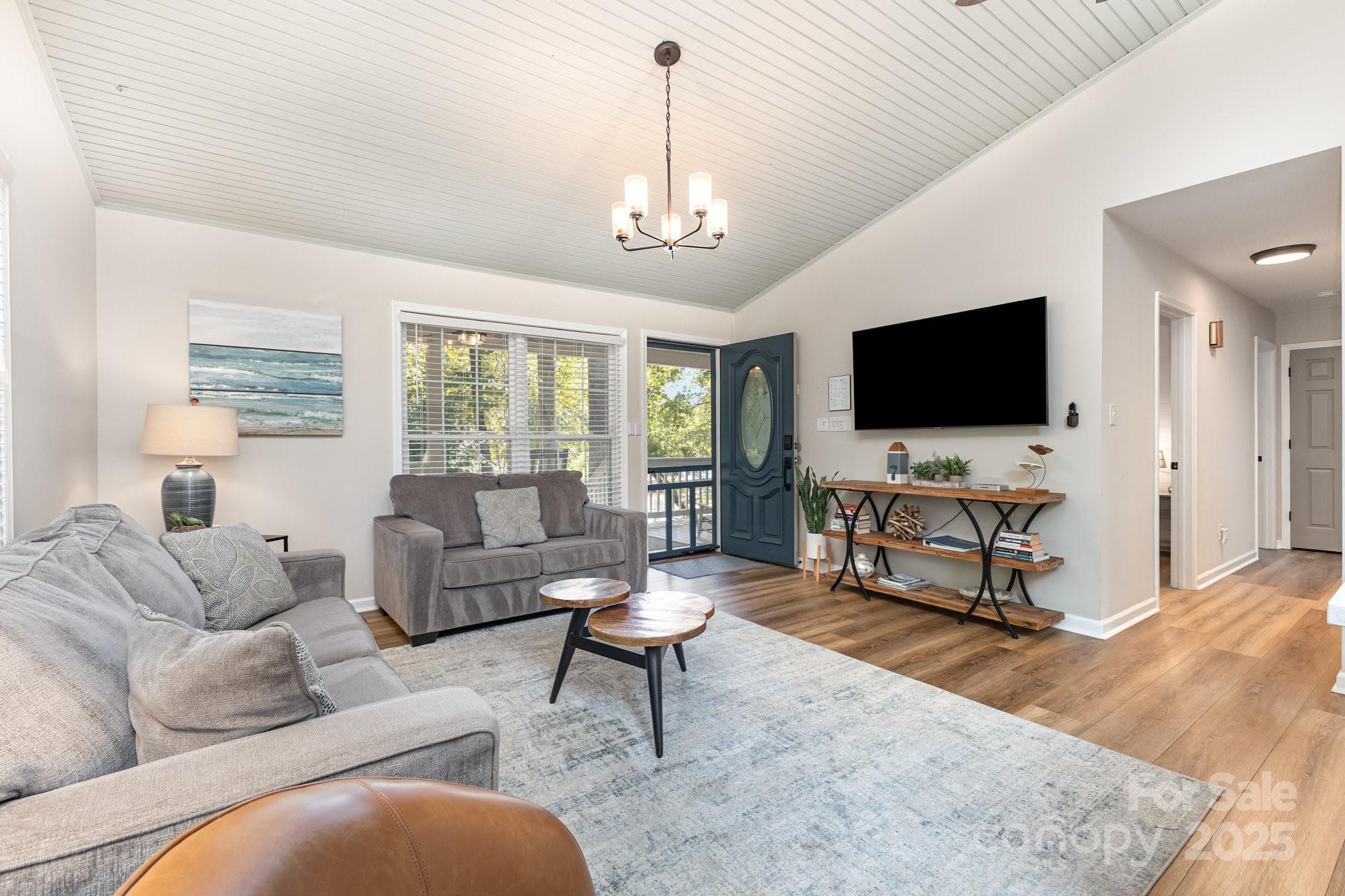 8410 Slate Street Terrell, NC 28682 - Photo 9 of 38 a living room with furniture and a flat screen tv