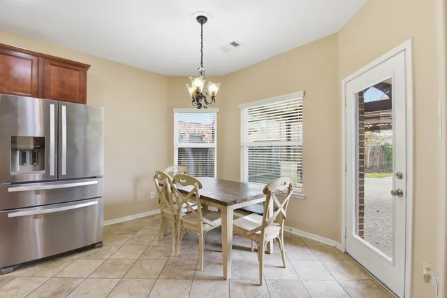 a view of a dining room with furniture window and outside view