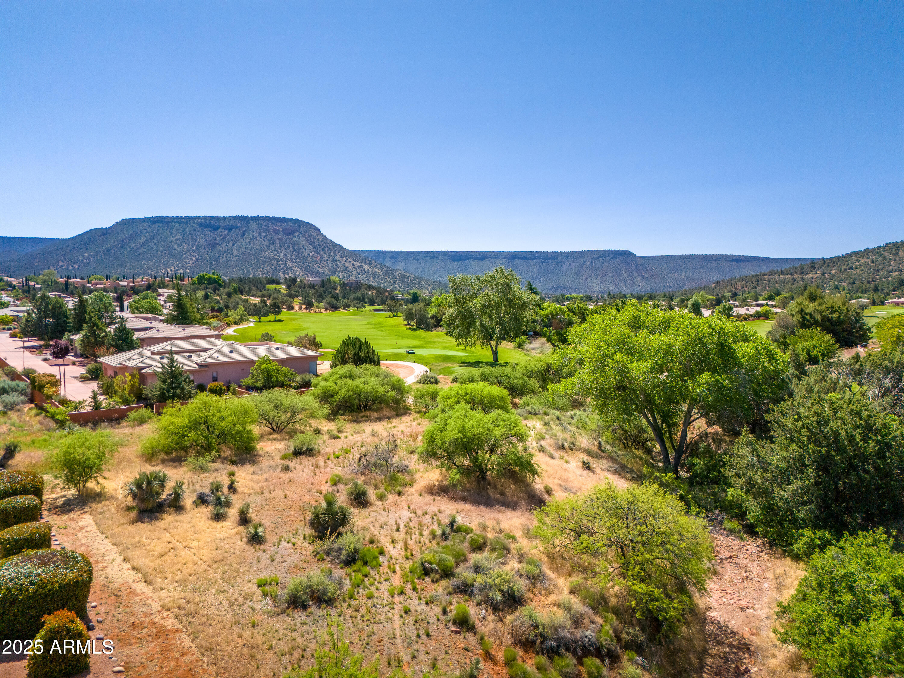 105 East Saddlehorn Road, Unit 161 Sedona, AZ 86351 - Photo 15 of 33 a view of a city with mountains in the background