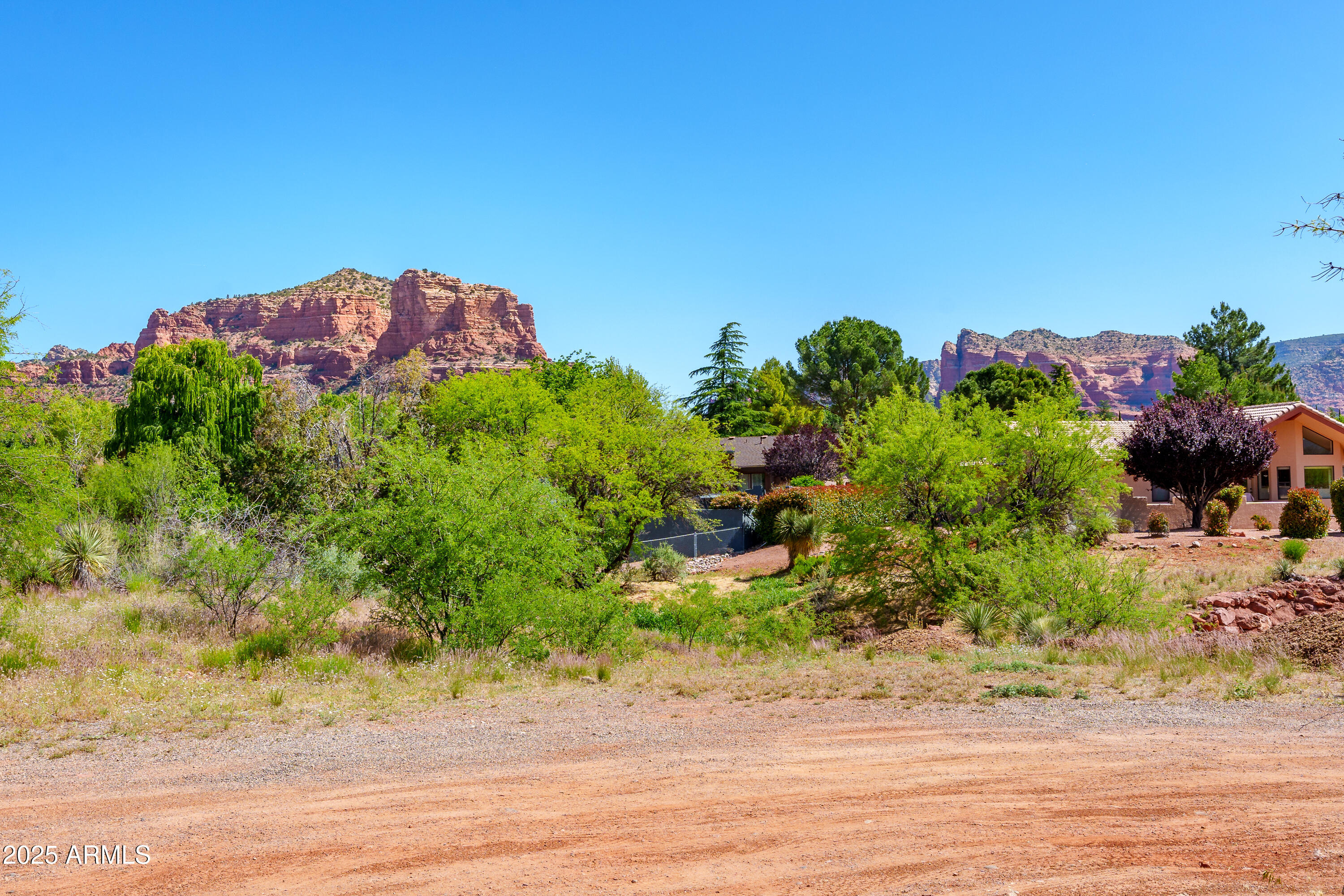105 East Saddlehorn Road, Unit 161 Sedona, AZ 86351 - Photo 19 of 33 a view of a house with a yard and garden