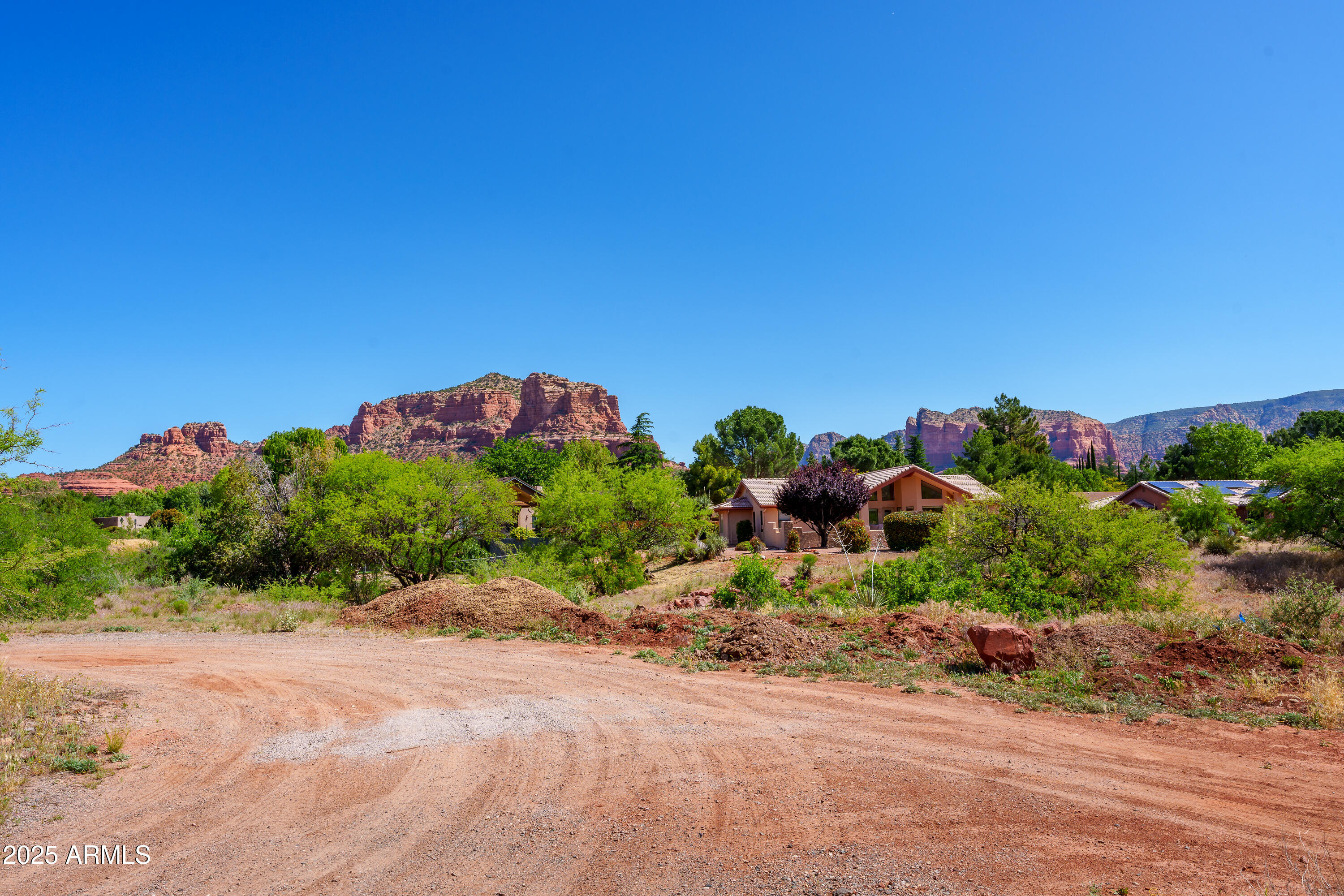105 East Saddlehorn Road, Unit 161 Sedona, AZ 86351 - Photo 20 of 33 a flower plants and garden in front of a house
