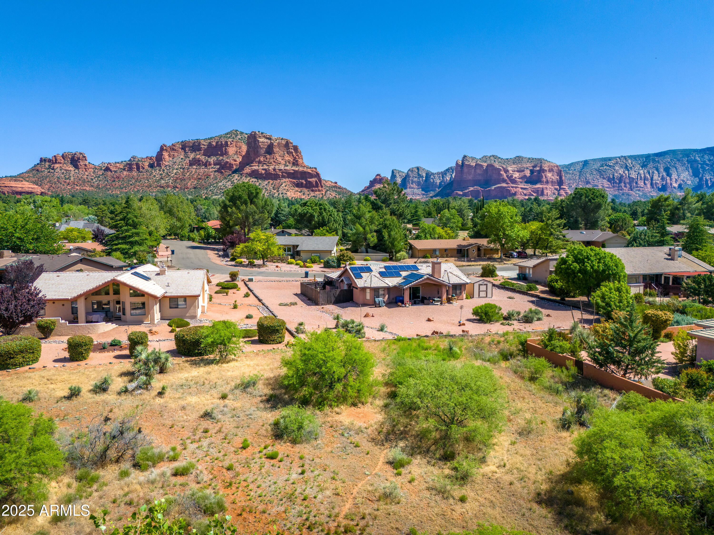 105 East Saddlehorn Road, Unit 161 Sedona, AZ 86351 - Photo 6 of 33 a view of a houses with a yard and a garden