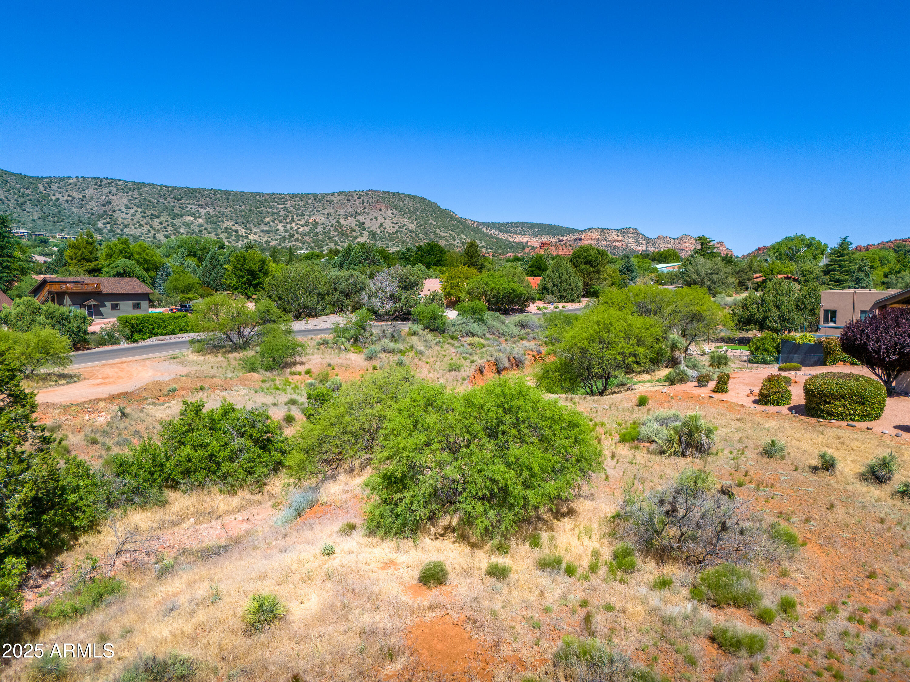 105 East Saddlehorn Road, Unit 161 Sedona, AZ 86351 - Photo 9 of 33 a view of a city with mountains in the background