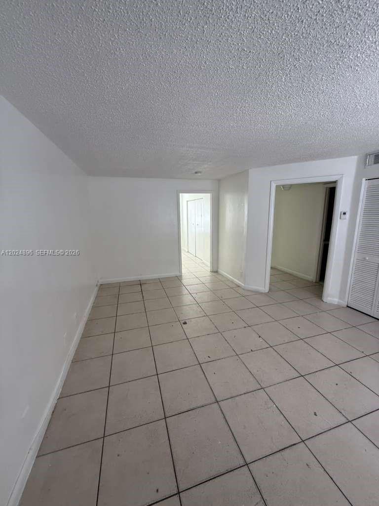 6921 Pembroke Road, Unit 6927 Pembroke Pines, FL 33023 - Photo 10 of 10 a view of an empty room and window