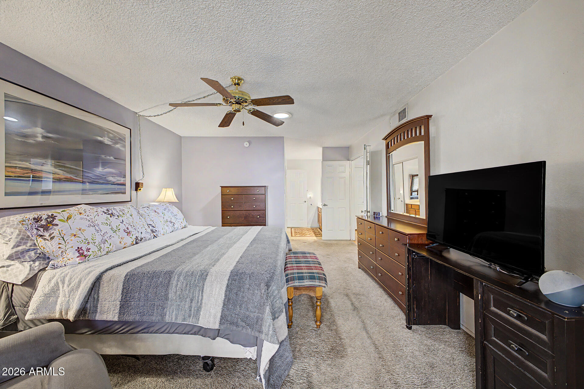 2659 West Hearn Road Phoenix, AZ 85023 - Photo 13 of 25 a bedroom with a bed and a flat screen tv