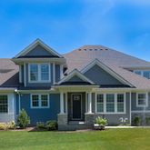 a front view of a house with a yard