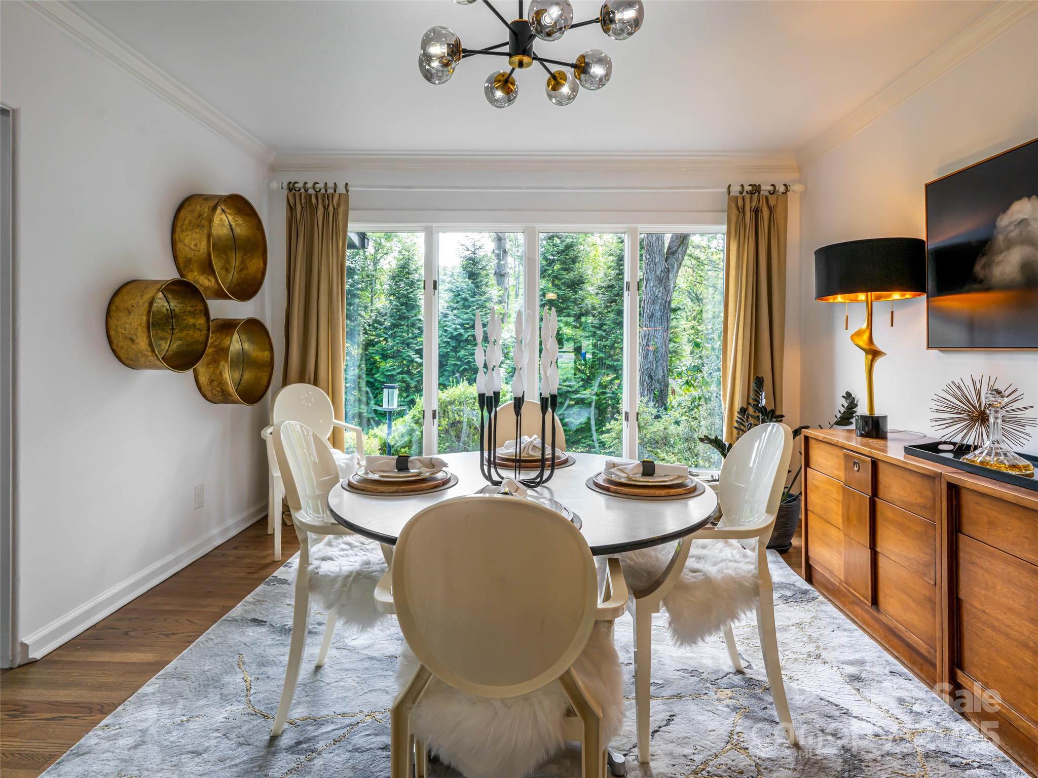 5 Busbee Road Asheville, NC 28803 - Photo 13 of 48 a dining room with furniture garden view and wooden floor