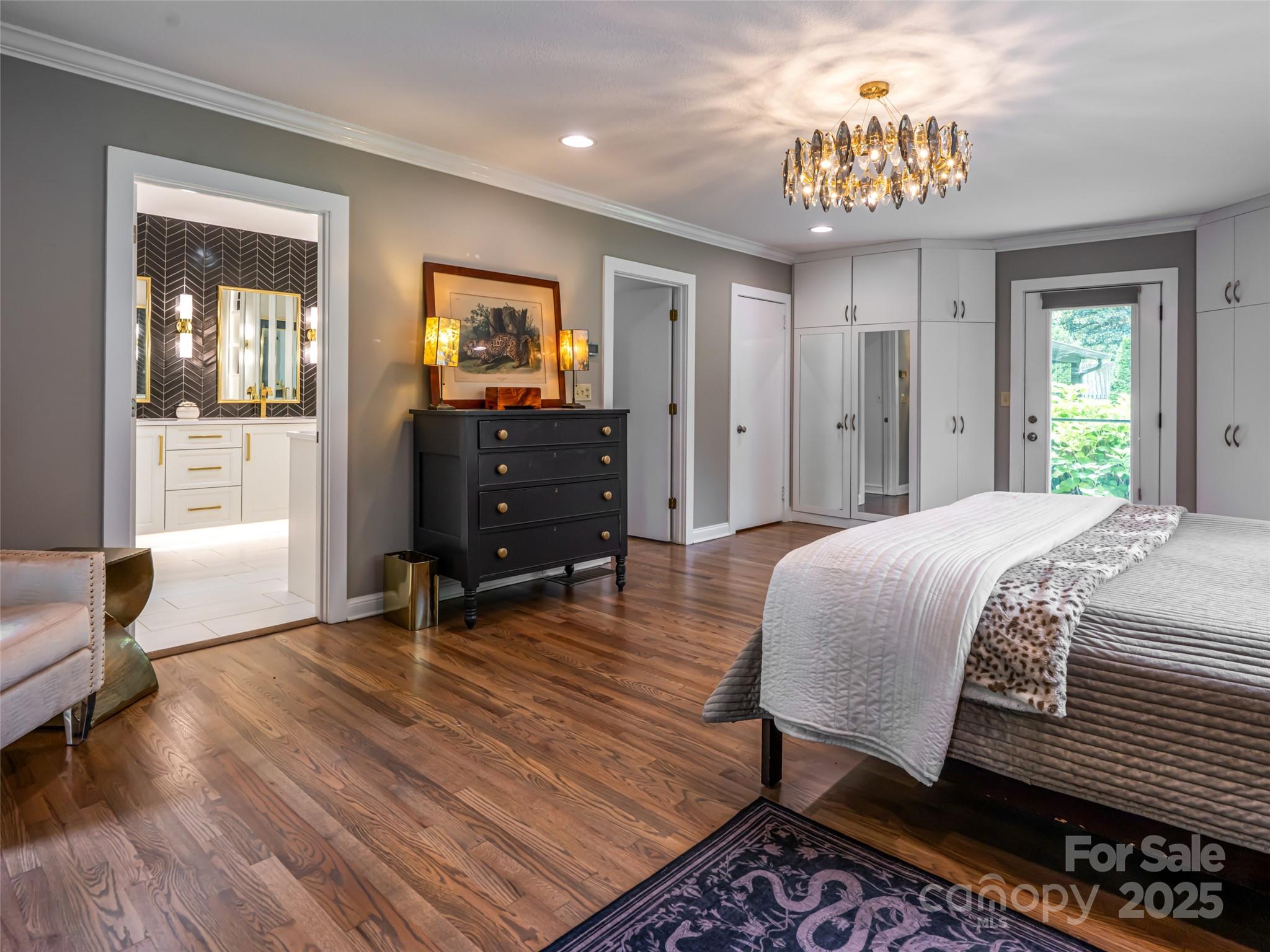 5 Busbee Road Asheville, NC 28803 - Photo 17 of 48 a bedroom with a bed and wooden floor