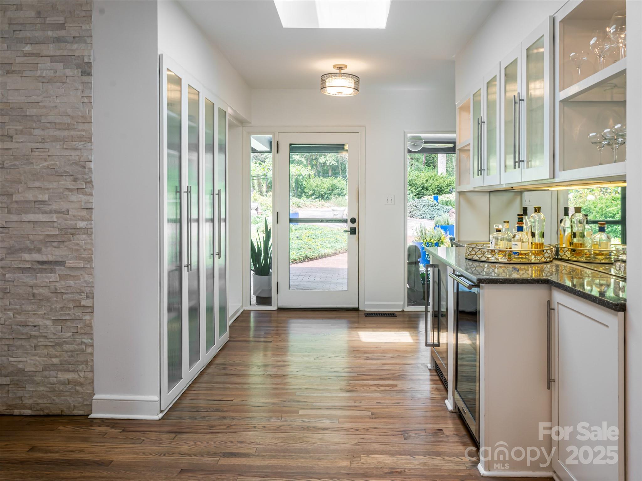 5 Busbee Road Asheville, NC 28803 - Photo 26 of 48 a dining room with furniture and wooden floor